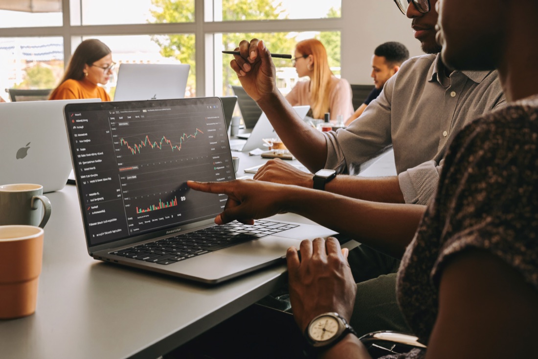 Two finance professionals reviewing a model